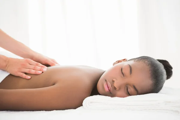 Woman enjoying massage at spa — Stok fotoğraf