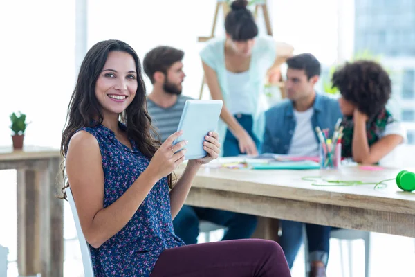 Smiling young women using digital tablet — Stock Photo, Image