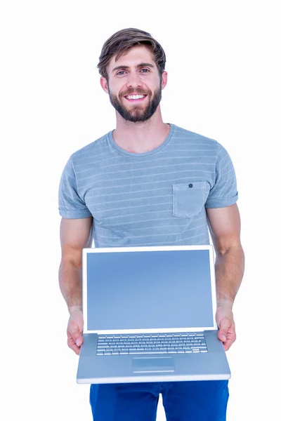 Joyeux beau homme tenant ordinateur portable — Photo