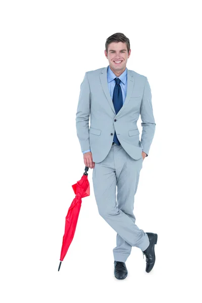 Smiling businessman with umbrella — Stock Photo, Image