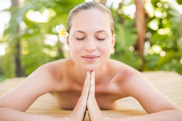 Peaceful blonde lying on massage table — Stok fotoğraf