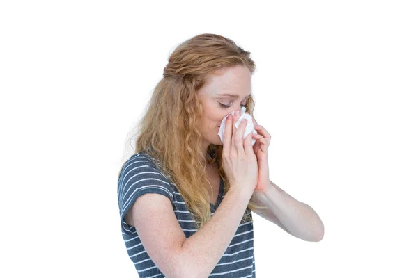 Sick blonde woman blowing nose — Stock Photo, Image