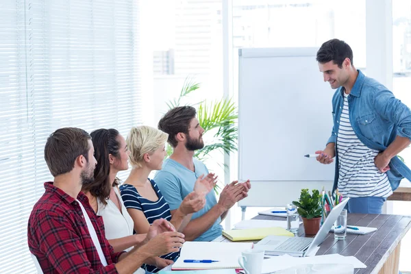 Casual business people clapping hands in meeting — Stock Photo, Image