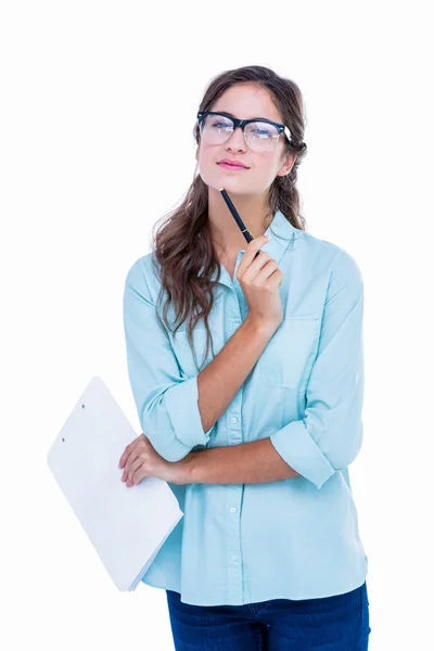 Doordachte hipster met pen tegen kin — Stockfoto