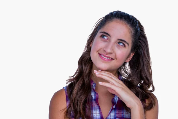 Woman with finger on chin — Stock Photo, Image