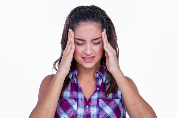 En söt brunett med huvudvärk — Stockfoto