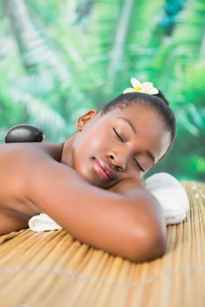 Woman enjoying hot stone massage — Stock Photo, Image