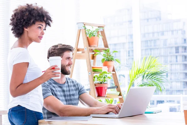 Creative business people using laptop in meeting — Stock Photo, Image