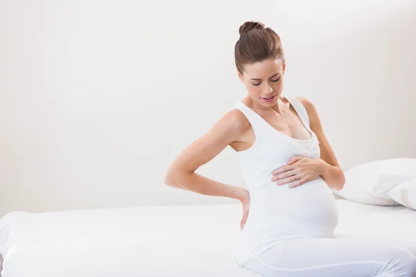 Pregnancy sitting on sofa — Φωτογραφία Αρχείου