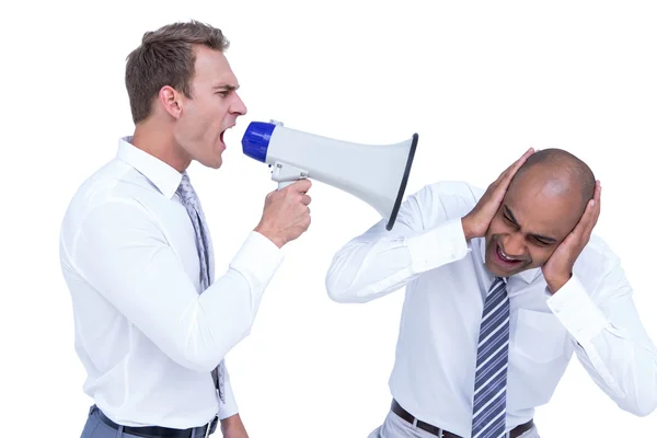 Empresário gritando com megafone com colega — Fotografia de Stock