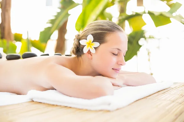 Blonde lying on towel at spa — Zdjęcie stockowe