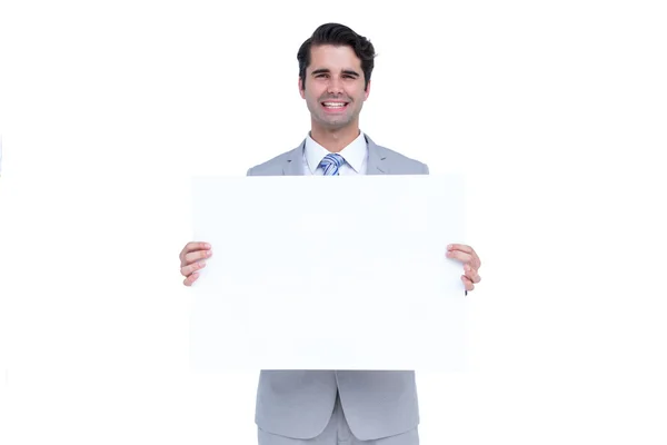 Бізнесмен тримає білий знак — стокове фото
