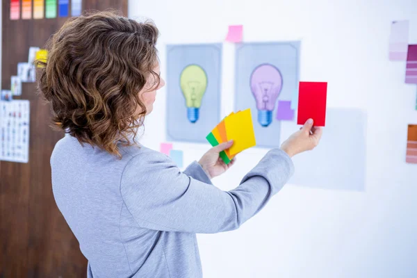 Creative businesswoman holding color cards — Stock Photo, Image