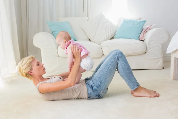 Happy mother with her baby girl — Stock Photo, Image