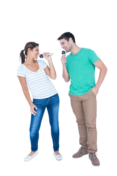 Two friends singing on microphone — Stock Photo, Image