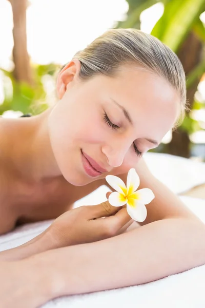 Blonde lying on towel at spa — 스톡 사진