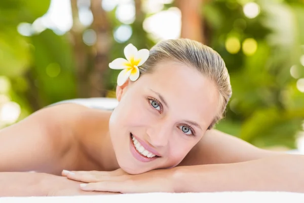 Blonde lying on towel at spa — Stock Photo, Image