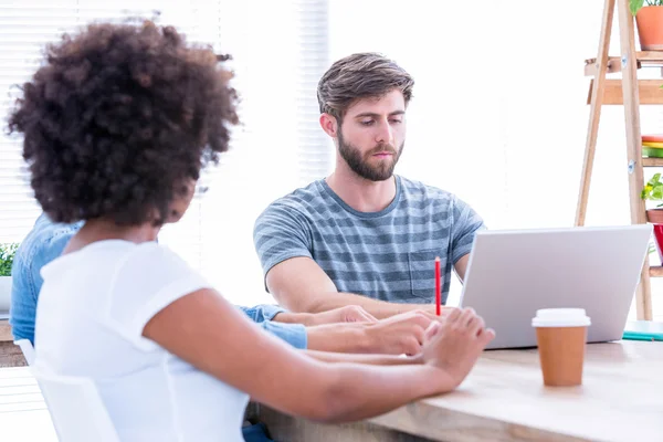 Creative business people using laptop in meeting — Stock Photo, Image