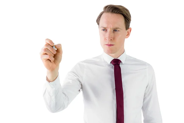 Businessman writing something with chalk — Stock Photo, Image