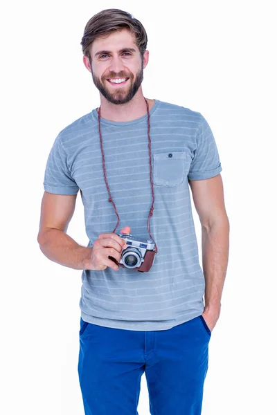 Homem bonito segurando câmera de fotos — Fotografia de Stock