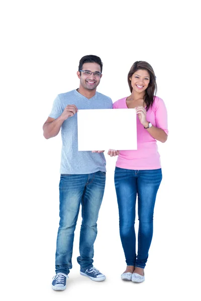 Friends holding blank sign together — Stock Photo, Image