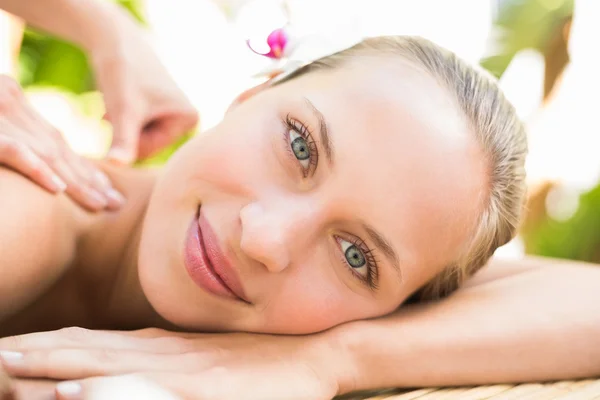 Attractive woman getting massage on her back — Stock fotografie