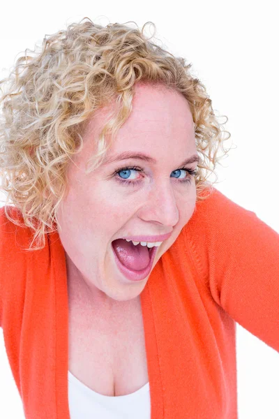 Blonde woman grimacing in front of camera — Stock Photo, Image