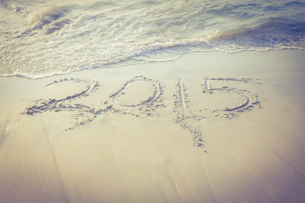 2015 on sand at beach — Stock Photo, Image
