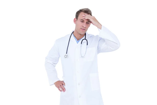 Worried young doctor in white tunic — Stock Photo, Image