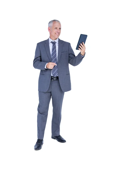 Businessman looking at tablet computer — Stock Photo, Image