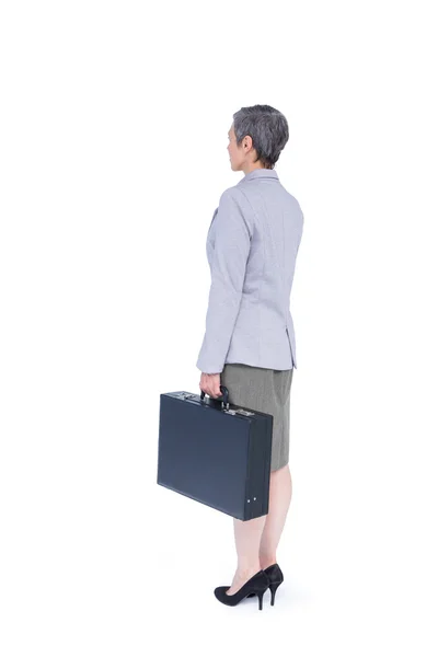 Businesswoman stranding with suitcase — Stock Photo, Image