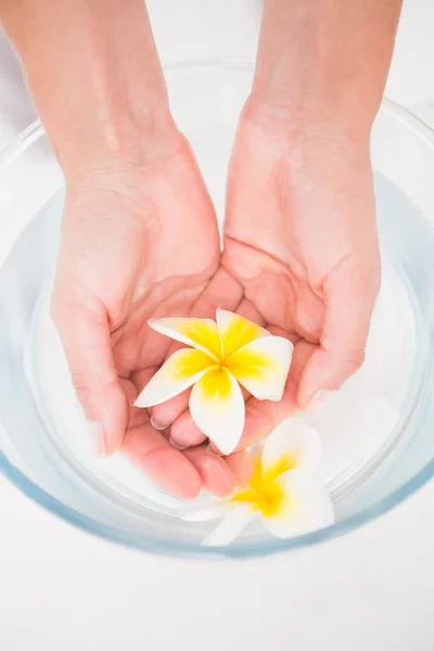 Woman enjoying hand treatment — Stock Photo, Image