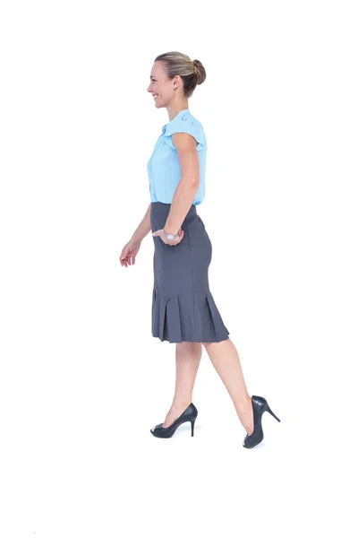 Businesswoman walking on white Royalty Free Stock Images