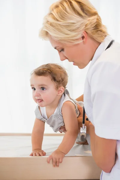 Doctor with child and stethoscope — Stok fotoğraf