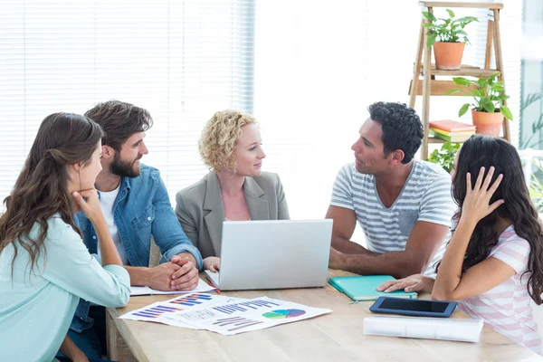 Colleagues using laptop at office — Stock Photo, Image