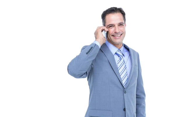 Retrato de um empresário bem sucedido no telefone contra o branco — Fotografia de Stock