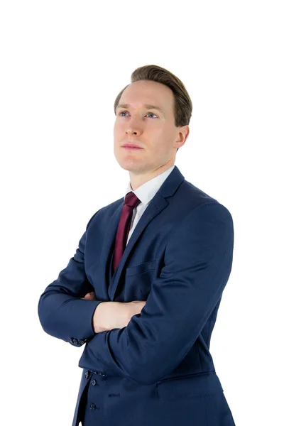 Thoughtful businessman looking away with arms crossed — Stok fotoğraf