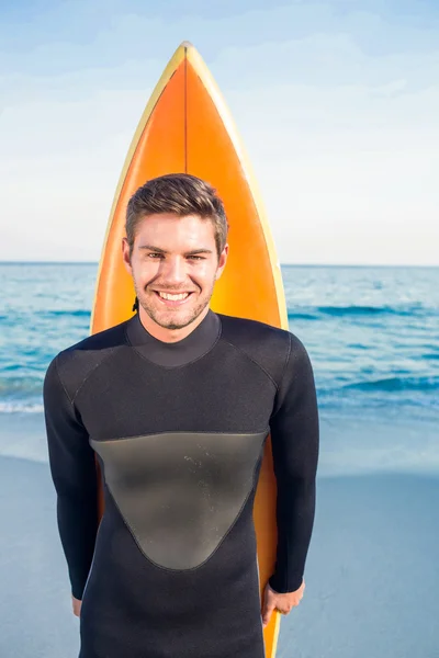 Man in wetsuit with a surfboard on a sunny day — Stock Photo, Image