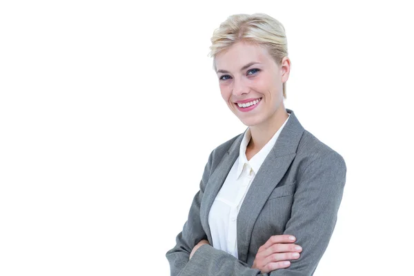 Mujer de negocios sonriendo sobre un fondo blanco — Foto de Stock