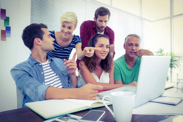 Creative business team using laptop in meeting — Stock Photo, Image