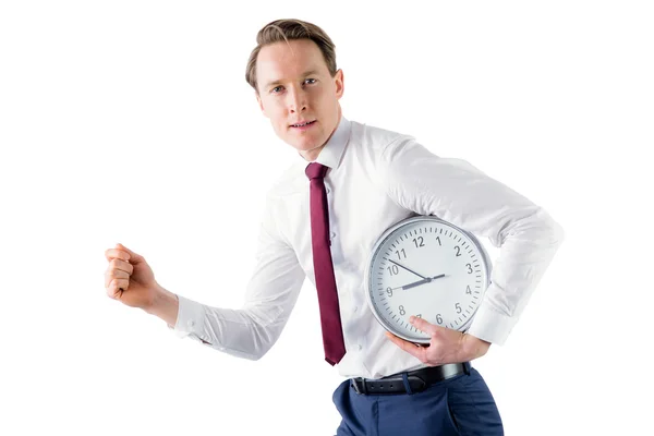 A businessman running with clock — Stock Photo, Image