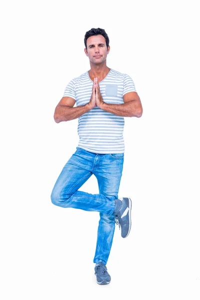 Handsome man doing the tree pose — Stock Photo, Image