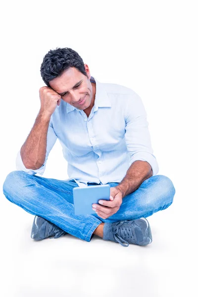 Handsome man using tablet computer — Stock Photo, Image