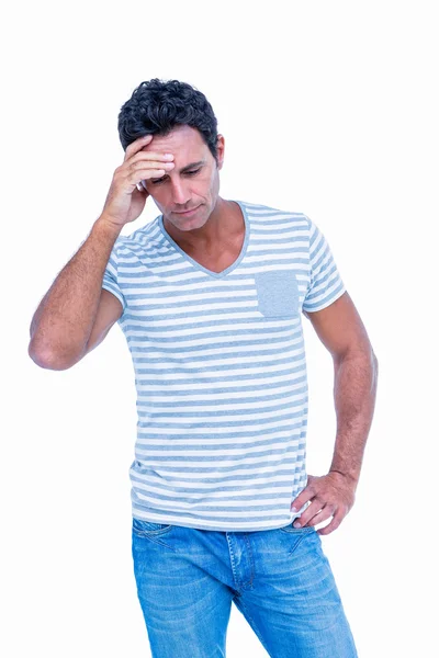 Sad man with one hand on head — Stock Photo, Image