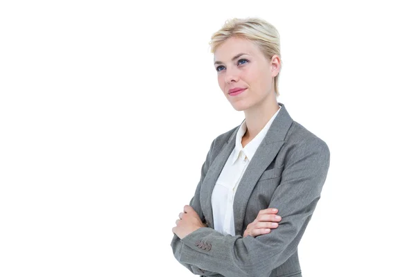 Mujer de negocios sonriendo sobre un fondo blanco — Foto de Stock