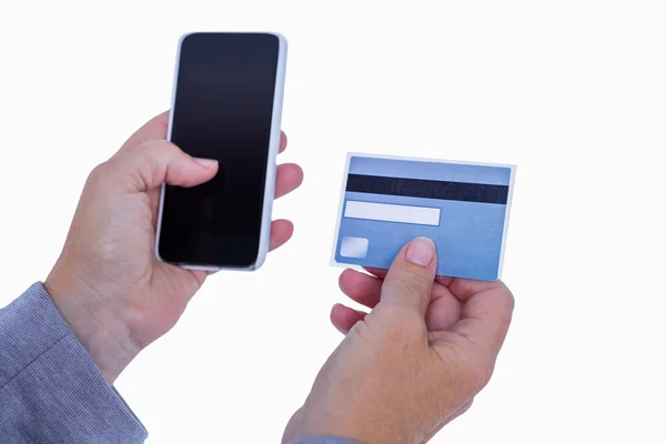 Woman holding credit card and smartphone — Stock Photo, Image