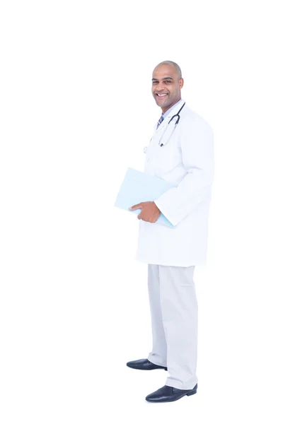 Doctor in white tunic writing notes — Stock Photo, Image