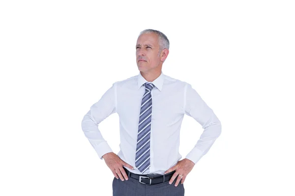 Serious businessman with hands on hips — Stock Photo, Image