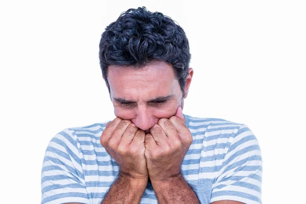 Stressad man med händerna framme på munnen — Stockfoto