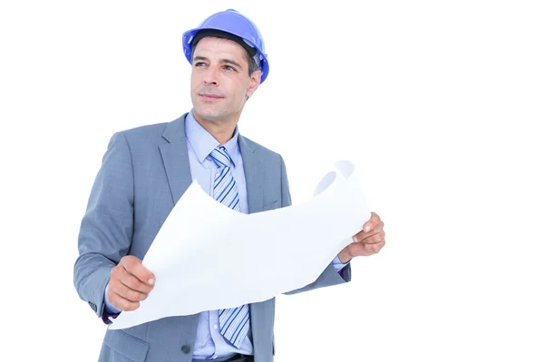 Businessman looking at a blueprint — Stock Photo, Image